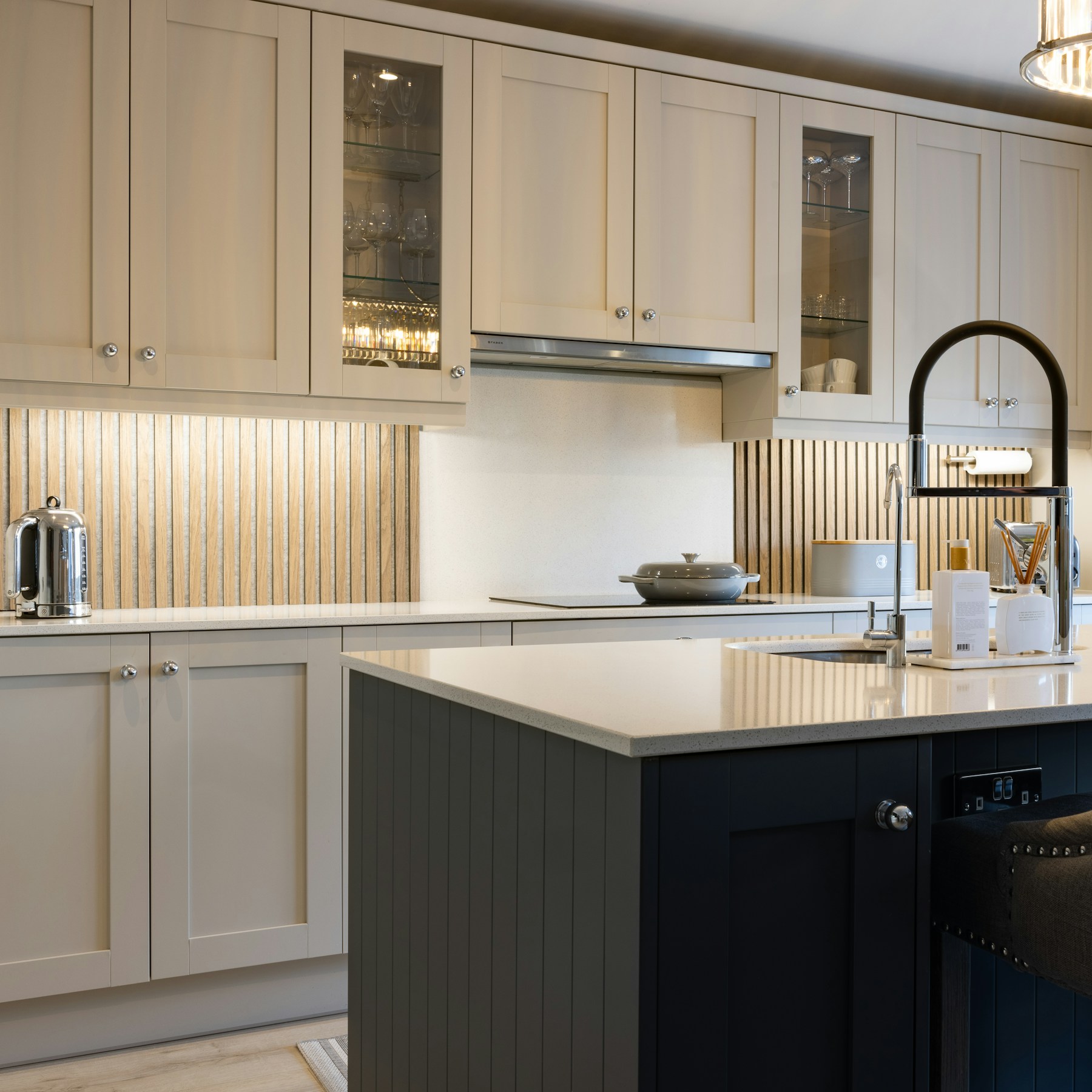 Transitional kitchen with Shaker cabinetry and warm finishes